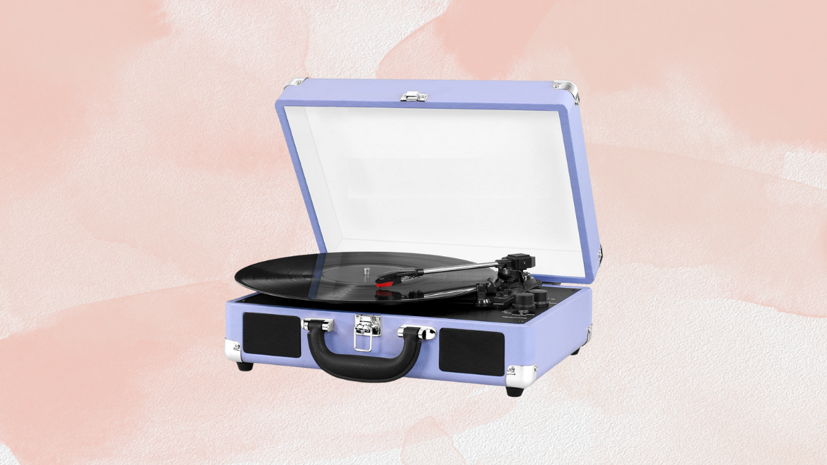 Vintage-style portable record player in a pastel lavender suitcase design, with an open lid revealing a spinning vinyl record.