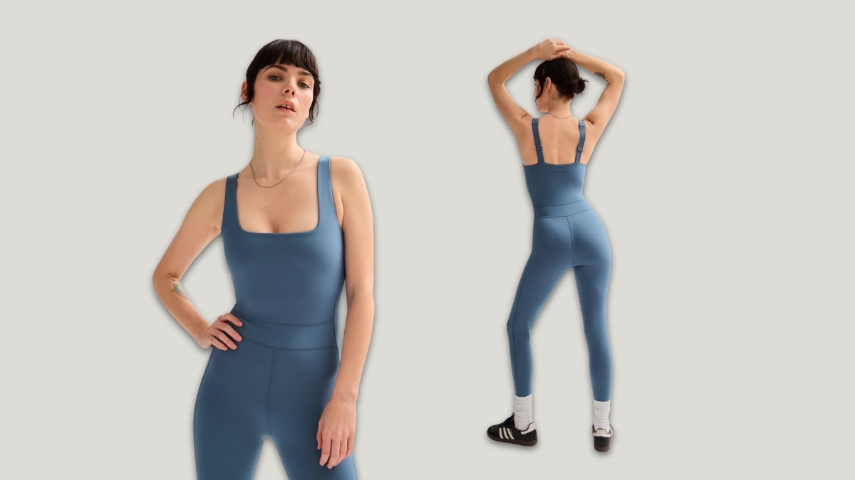 Model wearing a blue Girlfriend Collective unitard shown from front and back, highlighting the sustainable activewear’s supportive fit, square neckline, and flattering compression design for workouts and everyday wear.