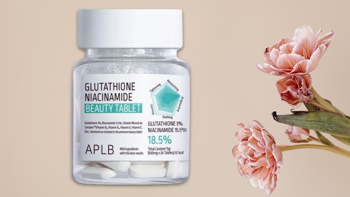 APLB Glutathione Niacinamide Beauty Tablet bottle on a beige background with pink flowers, highlighting Korean inner beauty supplement for brightening and radiant skin.