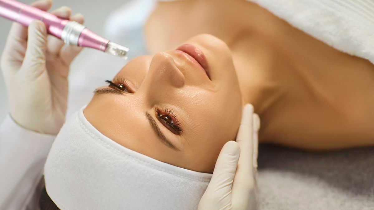 Microneedling facial treatment performed by a skincare professional using a dermapen device to improve skin texture and boost collagen.